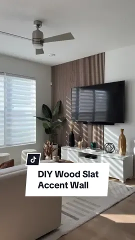I love how these wood panels from @The Wood Veneer Hub transformed our tv wall! It adds so much character to our living room and was so easy to install! what do you guys think?✨  Use code: MARIAM to get a discount off your order #DIY #woodpanel #tvwall #accentwall #diyhomedecor #woodveneer #diyproject #livingroomdecor #homeimprovement 