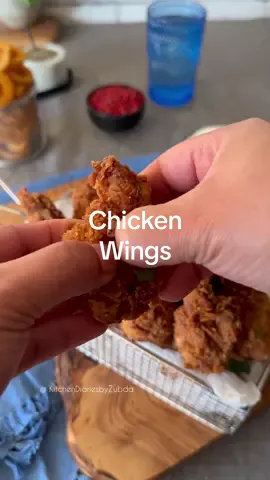 Chicken Hot Wings Full recipe on my blog. Link in my bio . Chicken hot wings are a popular and delicious dish made from chicken wings that are seasoned, coated, and fried until crispy. They are typically served as an appetizer or snack and are known for their spicy and tangy flavor. To make chicken hot wings, the wings are usually marinated in a mixture of buttermilk, pickle juice, and hot sauce. This helps to tenderize the meat and infuse it with flavor. The wings are then coated in a seasoned flour mixture, which often includes ingredients like salt, smoked paprika, garlic powder, white pepper, mustard powder, onion powder, and various other spices and herbs. Once the wings are coated, they are fried in hot oil until they turn crispy and golden brown. The frying process gives the wings a crispy exterior while keeping the meat inside juicy and tender. The cooking time for the wings is typically around 7-8 minutes, but it may vary depending on the size and thickness of the wings. Chicken hot wings are known for their spicy kick, which comes from the addition of hot sauce in the marinade and the option to serve them with additional hot sauce or spicy dipping sauces. The level of spiciness can be adjusted according to personal preference. These hot wings are often served with celery sticks and blue cheese or ranch dressing on the side. The cool and creamy dipping sauces help to balance out the heat from the wings. Overall, chicken hot wings are a flavorful and addictive dish that is loved by many for their crispy texture, spicy flavor, and finger-licking goodness. They are perfect for gatherings, game nights, or anytime you're craving a delicious and spicy snack.