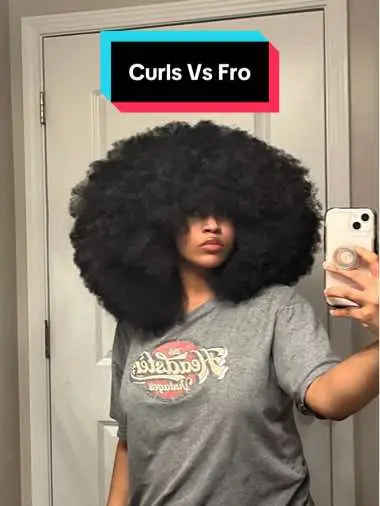 Look at the picture quality difference😭😂 iphone 15 is so much better. BUT My curls are unstretched in the first pic and my fro is picked out and stretched in the second. This is how horrible my shrinkage is. It almost looks like i barely grew my hair since middle school when i leave it fully shrunken😭#afrohair #naturalhair #afro #curlyhair #hair #hairtransformation #fro 