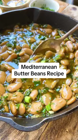 Mediterranean Butter Beans with Garlic, Herbs and Lemon - These Mediterranean Butter Beans are the next recipe in my “for the love of beans” series where I am sharing easy bean recipes! Beans are a secret ingredient for living a longer, healthier life! Beans, including kidney beans, black beans, chickpeas, and other beans in the legume family, are a big part of the Mediterranean diet. They are a great source of plant-based protein, fiber, complex carbohydrates, vitamins and minerals, while also low fat.  But here is the real talk for all of us busy home cooks, you can turn a humble can of beans into dinner in just minutes! In this easy weeknight recipe, canned butter beans simmer with lemony, spicy, herbaceous, garlicky flavor until tender and delicious. This satisfying vegan dinner is ready in just 15 minutes! Recipe: ▢ 2 tablespoons extra-virgin olive oil ▢ ½ teaspoon red pepper flakes ▢ ½ teaspoon Urfa pepper (optional) ▢ ½ teaspoon cumin ▢ ¼ teaspoon smoked paprika ▢ 4 garlic cloves, minced ▢ Kosher salt ▢ Black pepper ▢ 2 (15- ounce) cans butter beans, drained and rinsed ▢ 1 ½ cups vegetable broth ▢ Juice of 2 lemons ▢ 2 green onions, trimmed and chopped (both white and green parts) ▢ ⅓ cup roughly chopped parsley ▢ ⅓ cup roughly chopped dill #beans #beansrecipe #butterbeans #butterbeansrecipe #veganbeanrecipes #veganrecipes #plantbasedrecipes #plantbased #plantbasedprotein #mediterraneandiet #mediterraneanfood 