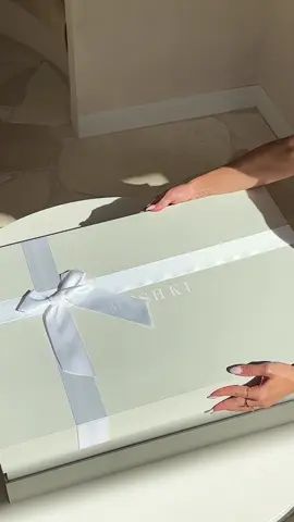 Unbox our EILEEN gown with us. 🤍 For a select range of MESHKI Bridal, your item will come boxed in our custom bridal packaging. Discover the collection. #MESHKI #weddingdress #unboxing #asmr #bridetobe #bridal #wedding #bridesmaiddresses #bridesmaid #fashioninspo #weddinginspo 