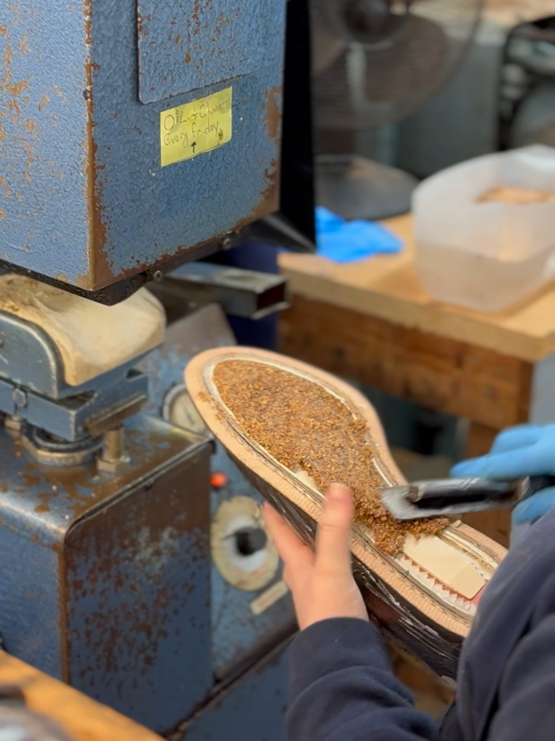 Tricker's Craftswoman applying cork filler The cavity between the Goodyear welt and insole is filled with a layer of cork, which moulds to the wearer’s foot, providing insulation and comfort. The cork is then covered with a leather mid-sole for protection.  The recipe for our cork is a secret, and we make it ourselves. #Shoemaking #Traditional #GoodyearWelted #SustainableFashion #SlowFashion #Trickers #MadeInEngland