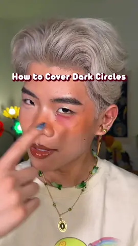How to Cover Up Dark Circles, hickeys etc any hyperpigmentation with detailed steps below! 1. they’re normal, everyone has them. 2. use something oppposite of your dark circle color. Most of us will have purple/blue circles so you should go for something orange/peach. • i used @Huda Beauty color corrector 3. Make sure the color is around your same skin tone in terms of depth, so if you took away the color, the tone is around your skin color still (example: don't use a dark orange if you're white. find a light peach or yellow) 4. you can use blush, eyeshadow, lipstick etc! doesn't have to be a color corrector specifically. 5. USE A LITTLE BIT don't blend it to areas where you don't have the dark circles. 6. Then go in with concealer, less is more. • I used @HausLabs triclone concealer 7. set with powder. #makeuptutorial #makeup #darkcircles #makeuptips 