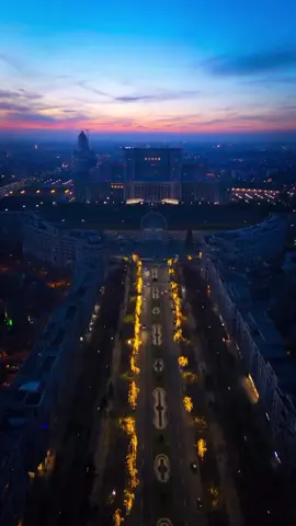 Why so massive? In the heart of Bucharest stands a testament to ambition, power, and concrete. The House of the People, now known as the Palace of the Parliament, looms over the cityscape, a behemoth born from the vision of a leader who aimed to etch his legacy in stone and mortar. This colossal structure, paired with the grand Unirii Boulevard, sketches a narrative of grandeur and excess that defines much of Romania’s capital. Together, they form a duo of architectural marvels that speak volumes about the country’s complex history and its strides towards modernity. The Palace of the Parliament is not just another government building; it’s the second-largest administrative building in the world, trailing only the Pentagon. With a staggering 365,000 square meters of floor area, and standing 84 meters high, this edifice is a record-holder in several categories: the heaviest building, the most expensive administrative building, and the largest parliamentary building in the world. Constructed in the 1980s under the dictatorship of Nicolae Ceaușescu, it required the ruthless demolition of a significant part of Bucharest’s historic center, including 30,000 homes and several churches, a controversial project that reshaped the face of the city forever. Unirii Boulevard, envisioned as the centerpiece of Ceaușescu’s Bucharest, stretches out from the Palace, aiming to outshine Paris’s famous Champs-Élysées. This wide boulevard, flanked by fountains, governmental buildings, and shops, was designed to showcase the prosperity and strength of Ceaușescu’s regime. Today, it stands as a stark reminder of a bygone era, drawing tourists from all corners of the globe. How does this blend of architectural might and historical weight resonate with you? Video by @razorsbk  [Casa Poporului, Palatul Parlamentului, House of People, Palace of the Parliament, Unirii Boulevard, Bucharest Landmark, Romanian Architecture, Largest Administrative Building, Ceausescu’s Project, Communist Heritage, Bucharest Attractions, European Parliament Buildings] #Travel #InstaTravel #TravelGram #Wanderlust #Traveling #romania