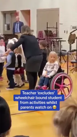 A heartbreaking video involving a disabled child at what appears to be an elementary school performance in front of parents has resurfaced after it appears that that the teacher 'excluded' her from the ongoing activities. #fyp #wheelchair #child #disability #school #heartbreaking  🎥 - Twitter // PicturesFoIder