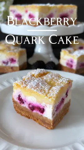Click here for the Recipe 🤍 Blackberry Quark Cake  Indulge in the tempting world of this Blackberry Quark Cake, where the fresh sweetness of blackberries combines with the velvety creaminess of quark, all covered by a crispy crumb topping 🥰 📝 Ingredients: For the Base: - 200 g butter cookies - 120 g melted butter For the Filling: - 500 g quark or cream cheese (unsalted) - 100 g sugar - 1 teaspoon vanilla extract - Juice of half a lemon - 1 egg - ⁠1 tablespoon cornstarch  - 250 g fresh blackberries (optionally cut into pieces) For the Crumb Topping: - 100 g flour - 50 g sugar - 75 g cold butter, diced 🤍 Instructions: 1. Crush the butter cookies into fine crumbs and mix with melted butter. Press the mixture into a rectangular baking dish (29 x 11 cm) to form an even base. Let it set in the refrigerator. 2. In a bowl, mix quark, sugar, vanilla extract, lemon juice, cornstarch and the egg until smooth. 3. Gently fold the blackberries into the quark mixture. 4. For the crumb topping, work flour, sugar, and cold butter cubes with your fingers until crumbly. 5. Spread the quark-blackberry mixture over the chilled cookie base and smooth it out. 6. Evenly sprinkle the crumb topping over the quark filling. 7. Bake the Cake in a preheated oven at 180 degrees Celsius for about 25-30 minutes until the crumb topping is golden brown. 8. Remove from the oven and let it cool completely. 9. Dust with powdered sugar before serving. Enjoy this Blackberry Quark Cake as a delightful and easy treat for any occasion! 🤍