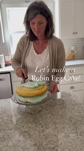 One of my favorite spring cakes to make…a Robin Egg Cake! I made this to celebrate my grandma’s 86th birthday tomorrow 🥰! The exact recipe I used will be in my spring recipe book which will launch on the first day of spring! Sigh up for our newsletter ro be notified when the recipe is available! Link is in my bio!  To make this cake, you can use any box cake mix of your choice, buttercream icing with just a splash of blue food coloring to make the perfect robin egg blue! To make the speckled egg look, I mixed 1 teaspoon cocoa powder with 2 tablespoons water. Use a pastry brush and dip in the cocoa mixture. Then flip the bristles to spray the cocoa on the cake and let dry! I’ll share how I made the edible birds egg nest tomorrow so be sure to come back❤️!!  Will you give this a try? Don’t forget to sign up for our newsletter! #edwardsfarmstead #robineggcake #springrecipes #springdessert #mycountryhome #bhg #bhghome #bhgfood #BakeWithMe #foryou #fyp 
