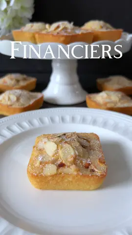 Click here for the Recipe 🤍 Financiers  Discover the artistry of French patisserie with our Financiers recipe. These delicate almond cakes bring together the full flavor of almonds and a gentle sweetness, perfect for a touch of French elegance in your everyday life. 📝 Ingredients: - 120 g powdered sugar - 60 g almond flour - 60 g all-purpose flour - 120 g unsalted butter, melted and slightly cooled - 4 egg whites (whipped to stiff peaks) - 1 tsp vanilla extract - A pinch of salt - Sliced almonds 🤍 Preparation: 1. Preheat the oven to 180 degrees Celsius. Lightly grease and flour twelve square muffin molds and set them aside. (Measurements of the molds: approximately 6.5 cm x 6.5 cm) 2. In a bowl, combine powdered sugar, almond flour, all-purpose flour, and a pinch of salt. 3. Add the melted butter and whipped egg whites. Gently mix until a smooth batter forms. 4. Stir in the vanilla extract. 5. Evenly distribute the batter into the prepared twelve molds. 6. Sprinkle sliced almonds on top of the Financiers. 7. Bake in the preheated oven for about 15-20 minutes, until golden brown and firm. 8. Allow them to cool slightly in the molds before transferring them to a wire rack. Lightly dust with powdered sugar. Enjoy these exquisite French Financiers as a token of fine delicacy! 🤍