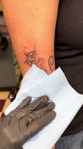 Coraline’s cat! Fresh on the upper arm. Healed Coraline on the outer forearm 💜 #coraline #coralinedoll #TimBurton #timburtonmovies #timburtoncharacter #tattoosoftiktok #tattoosofinstagram #femaletattooartist 