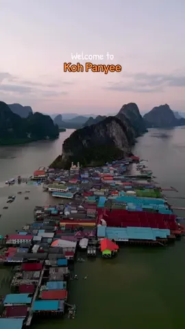 Welcome to Koh Panyee 🇹🇭 This floating village in Phang Nga Bay was created by nomadic fishermen who settled here long ago. Using traditional techniques, they built the village entirely on stilts.  The population, consisting of approximately 360 families, relies primarily on the fishing industry and tourism during the dry season to sustain themselves. Their unique culture and way of life make this village truly special. Walking through the narrow alleys offers a glimpse into their life on the water. 🎣 Don’t miss the chance to experience it firsthand, and if possible, consider hiring a private long-tail boat for a late afternoon visit. As most day tour visitors depart and the inhabitants close their shops, you’ll have the opportunity to observe their daily routine and further connect with them. With the population being predominantly Muslim, remember to respect the local culture and dress modestly. Head to the floating soccer field for the best sunset views before returning to the mainland. 🌅 #kohpanyee #kohpanyi #floatingvillage #phangnga #phangngabay #thailand #thailandtrip #thailandtravel #thailandfinds 