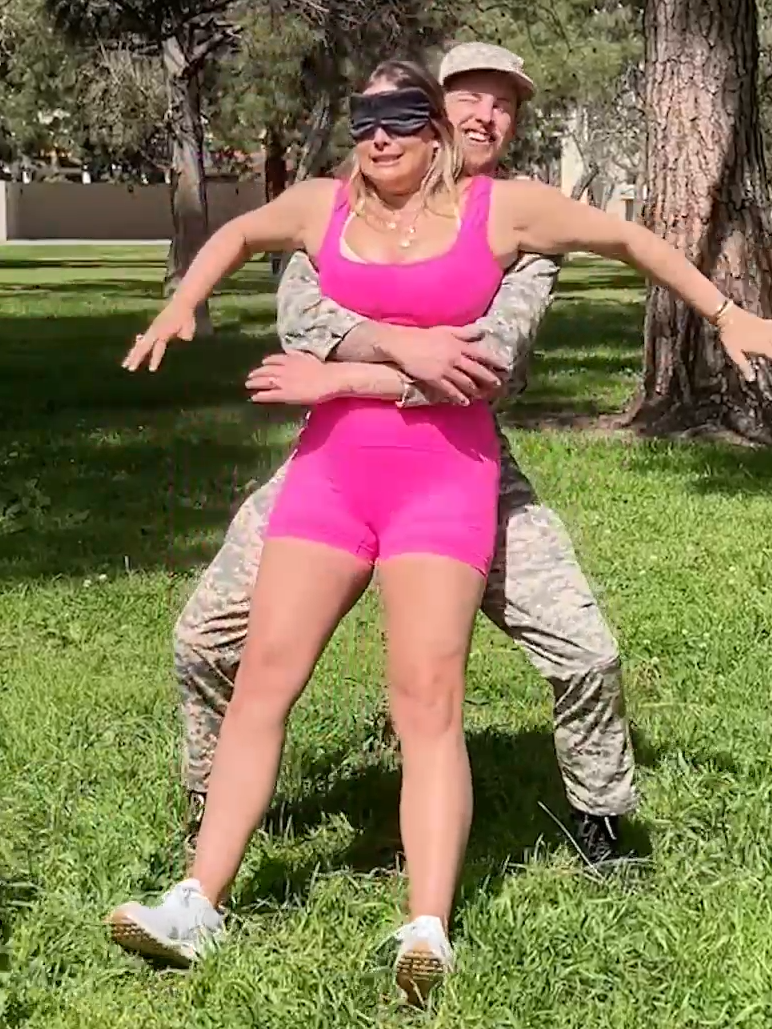 Soldier surprises wife in the park during a trust fall 🥹