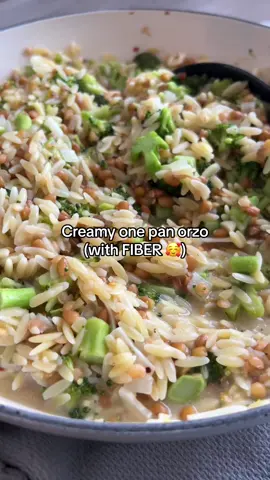 Here's how to make one pan creamy broccoli orzo! 💕⬇️ Serves 5-6 1-2 Tbsp olive oil  1 cooking onion, diced small  3 cloves of garlic, sliced thin    2 cups uncooked orzo  3/4 tsp salt   Black pepper to taste  1/2 tsp red pepper flakes (optional) 4 cups chicken broth   1 head of broccoli, diced small   1 can cooked lentils, drained and rinsed  1/2 cup grated parmesan (plus more for topping) 1/2 lemon juiced  1. Heat oil in a medium pan over medium heat (make sure it has a lid but don't use it yet). 2. Add onions and cook for 3 to 5 minutes or until they are translucent. Add garlic and cook for an additional 1-2 minutes or until the garlic is fragrant. 3. Add orzo, spices, chicken broth, and broccoli. Stir well and make sure all the orzo is covered with the chicken broth. 4. Reduce heat to medium low. Cook for 6 minutes covered. Stir halfway through to prevent the orzo from sticking to the bottom.  5. After the initial five minutes of cooking, add the lentils and stir. Put the lid back on and cook for an additional 6-8 minutes or until orzo is completely cooked. Stir halfway through to prevent the orzo from sticking to the bottom.  6. Remove lid and stir in parmesan cheese. Add lemon juice and additional black pepper before serving! #orzo #dietitian #onepanmeal #highfiber #healthycooking #easycooking #weeknightdinner