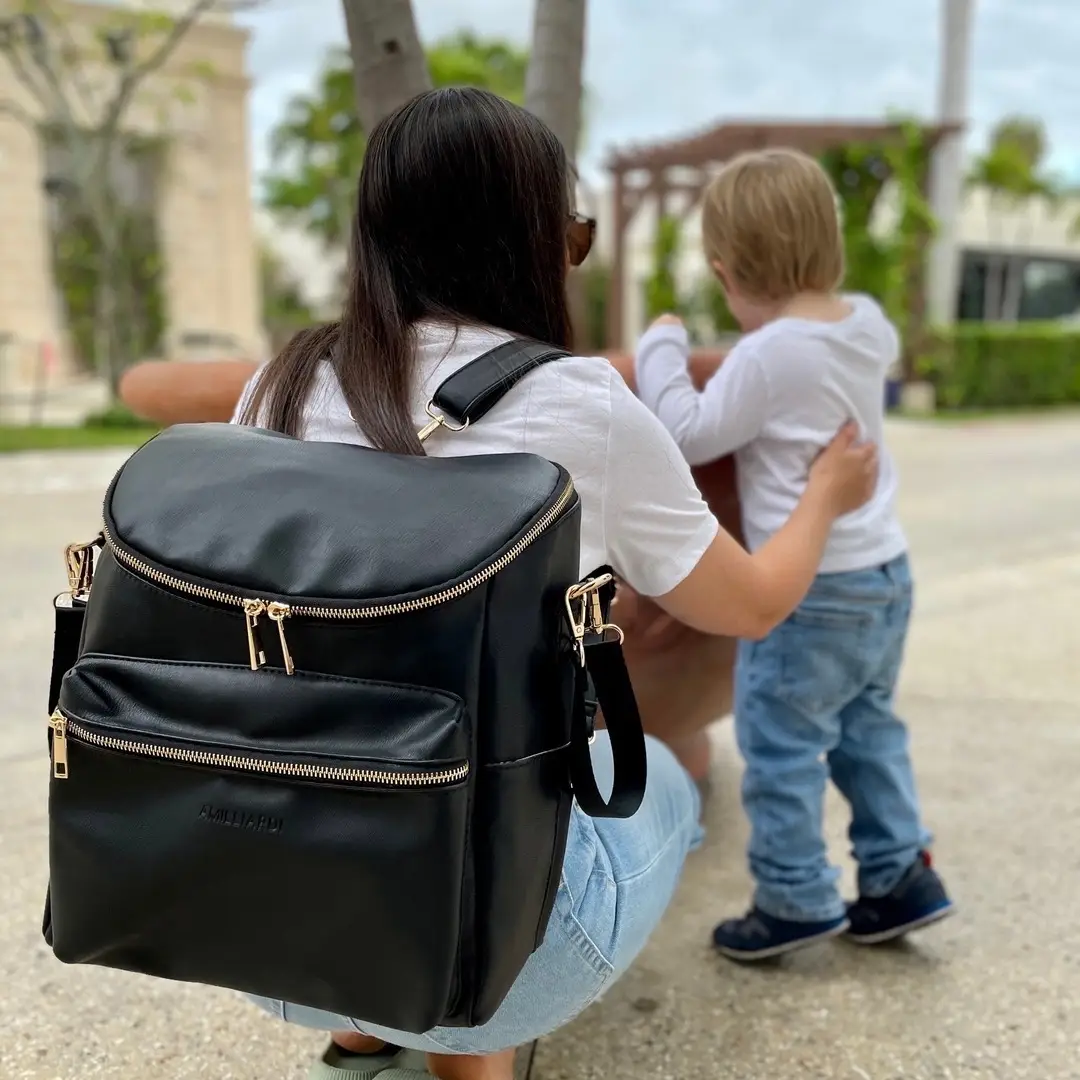 Best Diaper Bag of 2024: Our AMILLIARDI #veganleather Venice #DiaperBag features:	 ⠀⠀⠀⠀⠀⠀⠀⠀⠀ •2 insulated pockets plus a insulated bottle holder 🍼 for your baby bottles… snacks anyone? 🍬🍫 #kidssnacks #momsnacks #kidssnacksideas  ⠀⠀⠀⠀⠀⠀⠀⠀⠀ •1 additional insulated pocket for your mommy drink🥤 #momonthego #momlife 	 ⠀⠀⠀⠀⠀⠀⠀⠀⠀ •Comes with a lightweight portable changing pad, its oldable design makes it easy to carry inside your #diaperbag 👶🏻 💼 #diaperchange #babydiaperchange #diaperchangehack  ⠀⠀⠀⠀⠀⠀⠀⠀⠀ •Detachable messenger straps and detachable shoulder straps for versatility, allowing you to switch between carrying y our diaper bag #stylishmomma 👜  ⠀⠀⠀⠀⠀⠀⠀⠀⠀ •Stroller straps for a hands-free walk in the park #strollerworkouts #fitmoms #fitmomsoftiktok #fitmomlife 	 ⠀⠀⠀⠀⠀⠀⠀⠀⠀ •10 total divisions/pockets to carry all your newborn necessities with you #organizedmom #diaperbagessentials