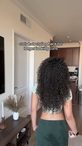 a longer curly hair hack i love!! by stretching only half my hair it elongates my curls & the top part (not stretched) gets all the volume which creates both voluminous & long curls  #curlyhair #curlyhairstyling #stylingcurlyhair #curlyhairstyle #curlyhairroutine #hairstyling 