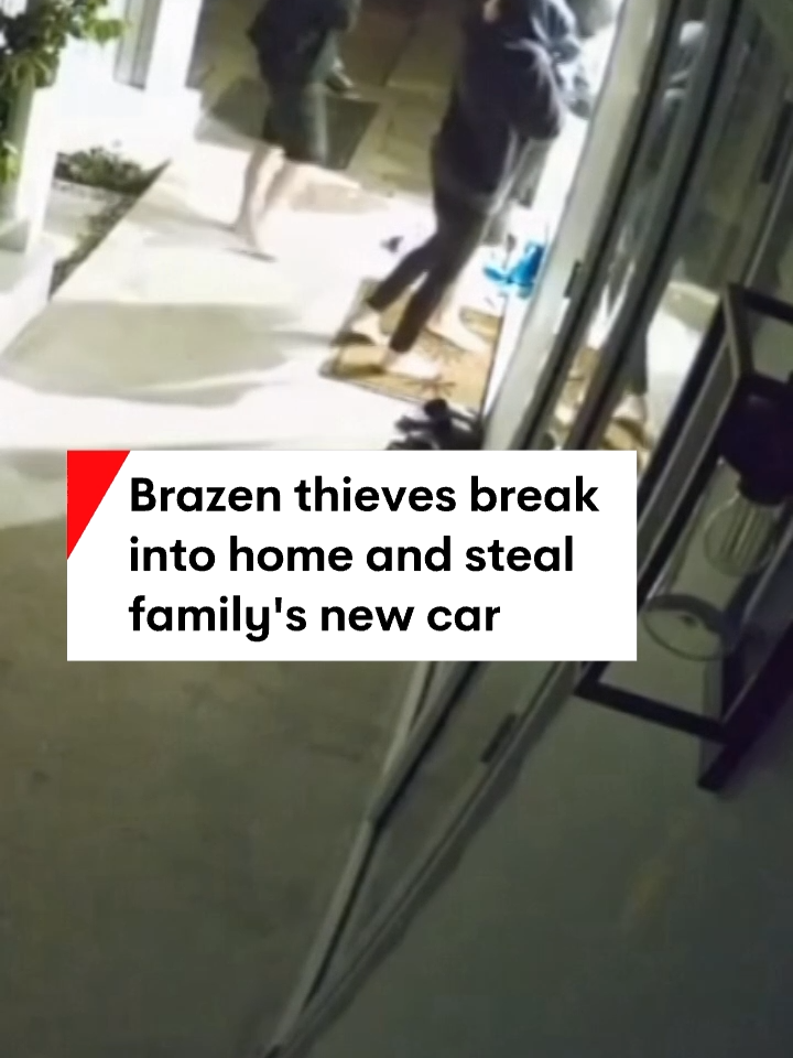 CCTV shows brazen thieves stealing from a Gold Coast home while a mother and baby were awake inside. They pushed the front door open, before helping themselves to keys and taking off in the family's new car with valuables inside. #7NEWS