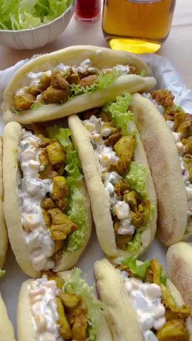 PAN BREAD FILLED WITH CHICKEN AND SALAD #chicken #thasnift #salad #bread #Recipe #food #fy #fyp #foryou #foryoupage DOUGH 200 g flour (all-purpose flour) 200 g fine semolina 6 g salt (1 teaspoon) 7 g yeast (dry yeast) 10 g honey 240 ml water (lukewarm)   CHICKEN SALAD 650 g chicken thighs 2 g coriander powder (⅔ teaspoon) 2 g turmeric (⅔ teaspoon) 3 g cumin powder (1 teaspoon) 3 g onion powder (1 teaspoon) 3 g garlic powder (1 teaspoon) 2 g cayenne pepper (⅔ teaspoon) 25 ml olive oil   60 g pickles 60 g corn 50 g red onion 100 g mayonnaise   Add the flour, fine semolina, salt, yeast, honey, and lukewarm water to a deep bowl. Mix well and knead for 10-12 minutes until smooth.   Cover the dough and let it rise for 1 hour in a warm place at home or until it doubles in size.   Deflate the dough and divide it into 9 equal pieces. Shape them into balls.   Take a ball of dough and roll it flat into an oval. Then fold the dough in half.   Coat the dough on both sides with fine semolina. Place the dough on a sheet of parchment paper and let it rise for 30 minutes, or until it doubles in size.   Wash and cut the chicken thighs into pieces. Place them in a deep bowl along with the coriander powder, turmeric, cumin powder, onion powder, garlic powder, cayenne pepper, and olive oil. Mix well.   Heat a frying pan over medium-high heat and add the chicken thighs. Cook for 5-6 minutes, or until they are cooked through. Let the chicken cool.   In a bowl, combine the chopped pickles, corn, diced red onion, and mayonnaise. Mix together.   Heat a skillet with a thick bottom over medium heat. Cook the bread rolls for a few minutes on each side.