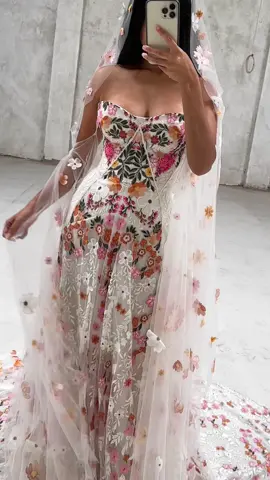 A gown with a story! 🌸 Blossoming from vision to vows, the Cora gown is a masterpiece created from dreams of love and hues of life.  A gown that embodies the colour, texture, and magic of the desert landscape in bloom. Would you wear Cora on your wedding day? Tell us below 👇 #CoraGown #RueDeSeineBridal #bridal #weddingdress #weddingday #weddingplanning #instawedding #weddinginspo #bridetobe #bridalstyle #2024bride #modernbride #elope #colouredweddingdress #weddingflowers #elopementwedding #elopementinspo #2024weddingtrends #weddingphotography #weddingtiktok #bridaltiktok #sewing #bridalsewing #dreamdress #bridalstyling #weddingdesigner #uniquedress #romanticdress #bridalshop 