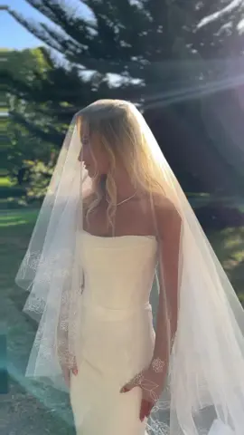 Jesse stuns on her wedding day in the DUKE gown paired with the KASIA Veil.  Captured by socials by ilio.#weddingday #wedding #bride #bridetobe #weddingdress #inspo #fashion #bridetok #modernbride 
