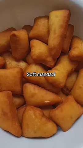 Soft mandazi recipe. Ingredients. *3 cups Self raising flour. *1 cup warm milk.  *2 Tbsp margarine.  *4 Tbsp Sugar.  *Oil for frying.  *Mix self raising flour and sugar.  *Add margarine and mix until you get a sandy texture.  *Add warm milk and knead to form a soft dough.  *Rest the dough for 1hr. Cut the mandazi into shapes and fry in hot oil.  *Oil should be hot. Not too hot or they'll burn outside before cooking inside.  *Turn the mandazi to ensure even browning.  *Enjoy.  *Self raising flour has baking powder added no need to add it.  *Don't add too much dough while kneading. You want a very soft dough.  #tastysahani #kenyanfood #kenyanfoodblogger #kenyanfoods #kenyanfoodie #mandazi #mandazirecipe #mandazi #mahamri 