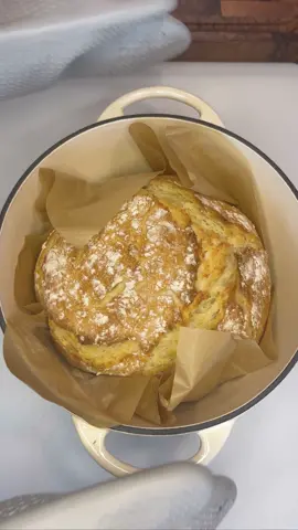 EASY NO KNEAD DUTCH OVEN BREAD!!! INGREDIENTS: * 3 1/2 cups +3 tablespoons flour * 1 3/4 teaspoons kosher salt * 1 tablespoon yeast * 1 teaspoon sugar * 1 egg * 3 tablespoons very softened (not melted) butter * 1 1/2 cups warm water DIRECTIONS: > Mix dough 3 hours before baking.  > Add dry ingredients to large mixing bowl. Lightly fluff with a fork. > Add egg, softened, butter, and warm water.  (around 110°. If no thermometer, temperature of water you could comfortably wash your hands in).  > Mix dough with fork (or hand stainless steel dough hook). Mix until ingredients are mixed and shaggy, tacky dough forms.  Cover bowl with saran wrap. (I use a plastic shower cap).  Let dough rise for 2 1/2 hours.  > Flour surface. Gently remove dough from bowl with spatula. Bring all the edges to the center and flip dough ball over. Don’t over disturb the nice bubbles that have formed in the dough.  Twist dough in a circle as you are gently tucking the edges under.  Place on piece of parchment paper.  Lightly sprinkle with flour & cover with saran wrap.   > Preheat oven to 450° with the Dutch oven inside for 30 minutes as dough rises.  > Remove Dutch oven from the oven. Place dough with parchment paper into Dutch oven. (works just fine. If you don’t have parchment paper, you can place the dough directly into the Dutch oven.) Place lid on top > Place the oven into the oven. Bake for 25 minutes. Remove lead and bake for another 5 to 7 minutes or until nice and browned.  > Remove from oven and place bread on cooling rack.  Cool for at least 10 to 15 minutes before slicing.  Slice bread, butter up, and ENJOY!!! *** delicious, topped with butter, honey, jam, or even dipped in olive oil and balsamic vinegar! #bread #dutchovenbread #nokneadbread #deliciousfood #easybread #baking #baker #Foodie #fyp 