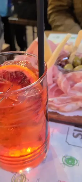 Apertivo at Simoni, a popular salumeria near Piazza Maggiore in Bologna. We had a meat and cheese plate with a spritz made with a local sparkling wine and local aperitif, similar to Aperol #italy #bologna #fyp #travel #aperitivo
