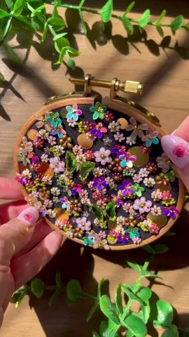 Midnight cherry blossoms anyone? 🌙🌸 #embroideryart #beadwork #behindthescenes #fairyart #fairycore #flowercore #dreamy #floralart #flowerart #beading #embroiderytutorial #sequins #sparklyart #walljewelry #microflowers #texturedart #sparklyvibes #springflowers #magical #witchyvibes 