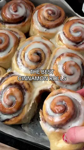 BREAD, EPISODE 4. Cinnamon Rolls 🤍 Makes 9 large rolls. For the dough: ▫️240ml warm milk (I used almond) ▫️70g butter, I used @floraplant ▫️7g instant yeast ▫️450g plain flour ▫️65g granulated sugar ▫️8g fine sea salt For the cinnamon filling: ▫️70g butter ▫️70g soft brown sugar ▫️2 tbsp cinnamon For the cream cheese frosting: ▫️75g DF cream cheese ▫️50g icing sugar Heat the milk and butter to 38-43C (I did this in 3 x 30 second increments in the microwave). Then, add in the yeast, stir, and leave to sit for 5 mins. Meanwhile, in a large mixing bowl, add in 380g of the flour (i.e. saving back 70g), the sugar and salt and stir. Pour in the warm milk mixture and start to bring the dough together. Add in the remaining 70g of flour and, when the dough comes together even more in a shaggy ball, transfer it onto counter. Knead for at least 10 minutes. You want the dough to be smooth and to spring back when you press it with a finger.   Transfer into a lightly oiled bowl, cover, and leave to rise in a warm place for 1 hour. Punch down the dough, then roll out into a large rectangle. Spread the cinnamon sugar butter evenly over the top, leaving a slight gap on the long sides. Divide into 9 strips (easiest using a pizza cutter to do this), then roll up and place into a lined 8x11 dish. Ensure the rolls are not too close together as they will expand more! Cover and leave to prove for 1 hour, or until doubled. Using a pastry brush, brush a little milk over buns (this makes them extra soft). Bake for 25 minutes at 160 degrees. Leave to cool for 10 minutes, then smother with the cream cheese frosting and ENJOY. #cinnamonrolls #breadmaking #cinnabon #veganrecipes 
