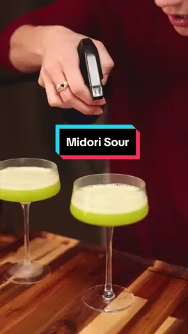 Meesh Make Me A Drink Ep. 5: the Midori Sour, from the homie @Chris (recipe taken directly from his post)  I have had the pleasure of trying Chris’ cocktails in person, and they were the best of my life - so I knew I had to try this one given his reaction - and @Meesh made it happen. It was my favorite yet. So fruity and delicious and drinkable without tasting cheap or overwhelmingly sweet. I could have 27 of them and bring shame to my whole family quite easily. @Jolly Rancher sponsor us.  #cocktails #cocktail #cocktails🍹#cocktailrecipes #midorisour #drinkreview #midori