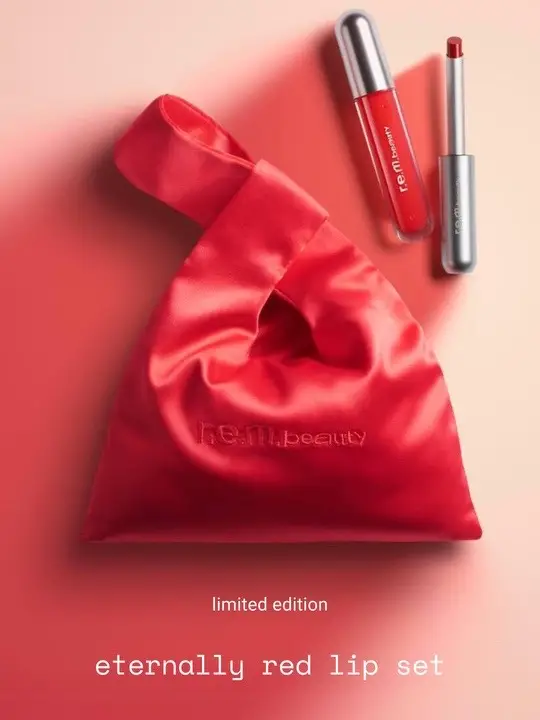 introducing the eternally red lip set ♾️☼ ⋆｡˚⋆ this limited-edition set puts a glossy spin on @arianagrande’s go-to red lip inspired by her latest album includes: ▫️ #onyourcollar classic lipstick in “attention” ▫️ #essentialdrip glossy balm in “shirley” ▫️ an exclusive red satin pouch that doubles as an evening bag available only on rembeauty.com ♡