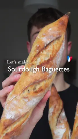 Sourdough Baguettes 🥖🇫🇷 ⠀ RECIPE 450 g bread flour 50 g whole wheat flour 380 g water 50 g active sourdough starter (use 100 g if below 22°C) ⠀ ❶ In a bowl mix flour and water. Cover and let it rest for 15 minutes. ❷ Add the active sourdough starter and salt, mix to combine, then cover and rest for 30 minutes. ❸ Let the dough ferment at room temperature for 4-8 hours or until almost doubled in size. Stretch & fold the dough every hour or whenever it has relaxed. ❹ Let the dough ferment in the fridge overnight or up to 24 hours. ❺ Divide the dough into 4 even pieces. Preshape and let it relax for 15 minutes. ❻ To shape the baguettes fold one side to the middle, then fold the other side onto the middle and fold again to seal the edges and create more tension. Thinly press and roll out the edges. ❼ Place the baguettes on a baking tray and let them proof for another 1-2 hours. ❽ Score using a razor blade or sharp knife. Then bake at 250°C (preferably with steam in the first 8-10 minutes) for 15-20 minutes until golden-brown. ❾ Let them cool for at least 30 minutes after baking (if you can 😉). ⠀ #sourdough #bakingbread #sourdoughbread #baguettes #breadbaking #cookingtiktok #breadtok 