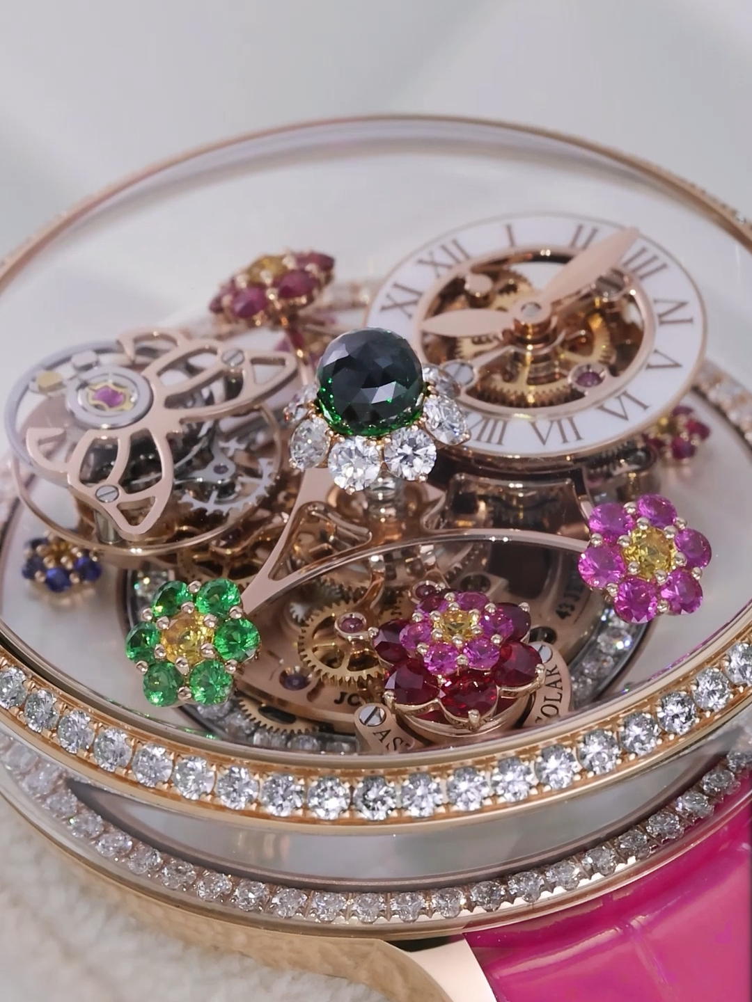 Fleurs de Jardin Pavé is the latest release in the long line of Fleurs de Jardin timepieces. Brilliant-cut diamonds, rubies, pink sapphires, yellow sapphires and tsavorites populate the flower beds of the rotating timepiece. A butterfly-shaped tourbillon carriage buzzes around them all.  #JacobandCo  #InspiredByTheImpossible #Luxurywatch #Fleursdejardin #lanadelrey