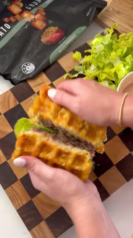 BIG MAC POTATO CRUNCHIES WAFFLE 🍔 Recipe below: Ingredients: - 250g @potatoutopia Crunchies (how many depends on the size of waffle maker) - 180g extra lean beef mince  - 1 slice of burger cheese - 1/4 cup roughly chopped lettuce - 4 pickles  - 1 tbsp finely chopped brown onion - Homemade Big Mac sauce: 1 tbsp mayo, 1/2 tsp mustard, 1 tsp tomato sauce, 1 tbsp pickle jar juice, 1 tsp finely chopped pickles, 1 tsp onion powder  Method: 1. Soften the potato crunchies in the microwave for 2-3 minutes  2. Preheat the waffle maker and add the potato crunchies. Close and cook until crispy (approx. 5 mins) 3. Meanwhile, mix your Big Mac sauce ingredients  4. Roll the mince with salt and pepper into a ball and add to a nonstick pan on high heat. Smash down using a spatula or meat press to create a patty. Flip after 3 minutes and add cheese in the last 2 minutes of cooking  5. Stack your Big Mac crunchy waffle with the Big Mac sauce, brown onion, lettuce, pickles, burger patty and remaining waffle.  6. Cut down the middle and enjoy!