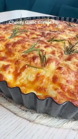 1 x pack filo  1/4 x cup oil  4 x garlic cloves  1 x tsp dried herbs (I used oregano)  Pinch salt & pepper  1 x @jarlsberg_ wedge (190g) Fresh rosemary  Custard: 1 x large egg or 2 small eggs  150ml full fat milk  Salt and pepper  2 x crushed garlic cloves  Preheat oven to 180C If you’re using baklava pastry like me you’ll double up the sheets if your filo is a little thicker you’ll use one sheet. Preheat oven 180C  Get a tart dish or round cake tin and add olive oil to the bottom. Mix your olive oil with crushed garlic, salt & pepper.  Fan fold each sheet or 2 sheets as shown in the reel, twist the first into a rose shape and spread the others around the rose starting where the last one finished. TIP, cover your pastry you haven’t used yet with a tea towel while you’re doing this so it doesn’t dry out.  Once you’ve filled out your tart case brush the olive oil mixture all over and in the sides so it’s fully coated. Bake for 13-15 min till golden coloured  While it’s in the oven grate your cheese and mix the custard ingredients together. Sprinkle the cheese over the park cooked pastry and then pour the custard mix over, top with fresh rosemary and bake for another 30-35 minutes on middle to low shelf. Cool for 5-10 min  Enjoy hot or cold  D 🫶 #cheesepull #cheese #garlic #EasyRecipe #fyp #Recipe 