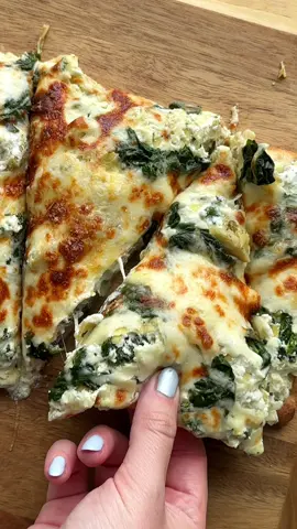 high protein spinach artichoke pizza 🍕  • - 1.5 cups cottage cheese (drained) - 1/2 cup plain greek yogurt - 1/4 ricotta - 1 tsp garlic powder - 1 tsp onion powder - salt & pep to taste - 1 cup frozen chopped spinach - 1 jar of artichokes drained & chopped - 1 cup shredded mozz - 1/4 cup shredded parm Instructions:  - In food processor or blender, blend together cottage cheese, yogurt, ricotta, garlic powder, onion powder, salt & pep. - Add blended cheese mixture to large bowl, and stir in chopped spinach, artichokes, and some of the shredded mozz & parm.  - Once combined, add mixture evenly to pizza/flatbread/etc. top with more spinach, artichokes, and cheese. - Bake at 350 for 10-15 mins until melty. Broil for final 2 mins to brown the cheese on top. Slice & enjoy!  #highprotein#proteinmeal#mealprep#highproteinmealprep#proteinpizza#spinachartichoke#cottagecheese#fyp#FoodTok#easymeal#DinnerIdeas 