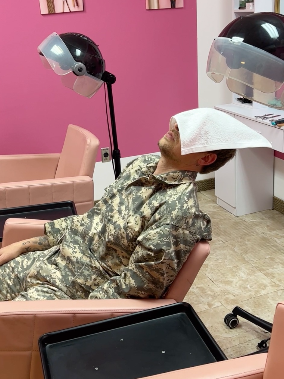 Exhausted soldier sleeps in barbershop