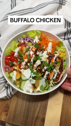 BUFFALO CHICKEN SALAD 🥬🍗🔥 This salad is soooo good 🙌 Even my husband who usually doesn’t like salad LOVES this one!! It has so much flavor and only takes about 25 minutes to make, so is perfect for busy weeknights!  I love prioritizing protein on a salad because it makes them more filling and satiating, and this salad packs 55g of protein, plus lots of veggies and healthy fats! This recipe makes 2 salads.  Salad ingredients:  - 1 large chicken breast  - 2 tbsp blackened seasoning  - 1 tsp olive oil  - 1 head of romaine, chopped  - 1 cucumber, sliced  - 1/2 cup cherry tomatoes, halved - 1 carrot, grated  - 1/4 of a red onion, thinly sliced  - 2 tbsp buffalo hot sauce  - 2 tbsp crumbled blue cheese for topping - 1 diced green onion for topping Homemade blue cheese dressing:  - 1/2 cup full fat plain greek yogurt  - 1/4 cup crumbled blue cheese - 2 tbsp vinegar (can use white vinegar, apple cider vinegar or lemon juice) - Salt + pepper to taste How to: - Butterfly the chicken breast then pound out to about 1/2 inch thickness.  - Season both sides well with blackened seasoning.  - Heat olive oil in a skillet, then sear chicken for 5-6 minutes per side or until cooked through.  - While the chicken is cooking slice up all of the veggies and make the blue cheese dressing by whisking together all of the ingredients.  - Add romaine and sliced veggies to your plate, then top with sliced chicken. Drizzle on blue cheese dressing and buffalo sauce.  - Garnish with crumbled blue cheese and diced green onion. Enjoy!  #healthyrecipes #EasyRecipe #dinner #dinneridea #buffalochicken #buffalochickensalad #saladrecipe #healthydinner #highprotein #cleaneating 