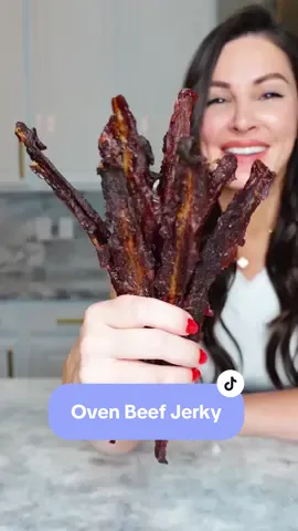 Sweet and Spicy Oven Beef Jerky inspired by Hot Hand on @Cafe Casino  This high protein snack is perfect for on the go and can be stored in an airtight container up to one month. You can substitute regular honey with keto honey if on a low carb diet.  Nutrition per slice: (Using regular honey)  85 calories, 10g protein, 5 net carbs, 2.8g fat  (Using keto honey) 73 calories, 10g protein, 0 net carbs, 2.8g fat Ingredients: 2lbs flank steak, sliced thin (1/8th inch thick) 1/2 cup sriracha  1/2 cup honey (or keto honey) 2 tsp garlic salt 30-35 wooden toothpicks  Directions: Combine all ingredients and marinade for four hours.  Place a toothpick through the top of each slice. Place a foil line sheet pan on the bottom rack of your oven to catch dripping.  Place the toothpicks up and over the top rack, leaving space in between each slice of beef. Bake in a 170° oven with the door slightly open to allow air to vent. Once your jerky is firm, but still slightly pliable, it’s ready.  Remove toothpicks and store in an airtight container for up one month in the pantry or in the fridge for up to 3 months.  Tip: Before slicing beef, freeze for 40 minutes to firm to allow more precise cuts.  Enjoy! #homemadejerky #ovenjerky #beefjerky #highproteinsnack #sweetandspicy