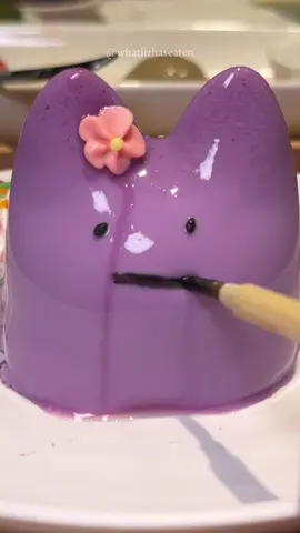 Finally tried the viral jiggly cat pudding! 🫨😻 This is taro flavoured and looks just like ditto, so I tried to draw a ditto face but it unfortunately failed 😫 • 📍 Kohaku Sabo 琥珀茶房 (Chinatown Point) • #cute #pudding #jelly  #japanesefood #japan #ditto #pokemon #coquette #foodtiktok #dessert #sgfoodie