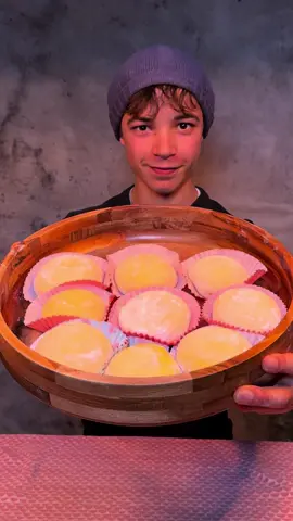 Mango mochi Have you ever tried mochi? Ingredients: - 300 gr glutinous rice flour - 82 gr cornstarch - 110 gr sugar - 350 ml milk - 41 gr butter - 100 gr mango pulp Mango filling - 750 gr mango - 150 gr sugar - 2 limes - 2 star anise Cream - Heavy cream - Icing sugar  How to; 1. Mix the rice flour with the cornstarch, sugar, mango pulp and milk until smooth  2. Put the dough in the bowl. Put in the microwave for 1 minute on high and stir. Repeat another 2-3 times or until the dough is formed and there is no liquid anymore. 3. Mix in the butter until the dough is stretchy 4. Make the jam by slicing the mango in small pieces and mixing it with. The sugar, lime juice and star anise in a pan on medium heat until thickened and let cooldown 5. Beat the heavy cream and icing sugar until stiff 6. Make 16 equal balls. Roll out on a with rice flour dusted surface, put in the jam and heavy cream and close. 7. Put in a baking cup liner and let cooldown in the fridge for about 30 minutes. 8. Serve and Enjoy! #mango #mangomochi #mochi #japanesefood #japanesesnack #japanesemochi #dessert #Recipe #cooking #baking