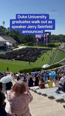 Graduates staged a walkout at the Duke University commencement ceremony in Durham, North Carolina, on May 12, just before comedian Jerry Seinfeld was due to speak. Video filmed by Cary Cheshire shows graduates walking out and a mix of booing and cheers at Duke's Wallace Wade Stadium as Seinfeld was introduced at the event. Seinfeld, whose children attended Duke, gave a speech and was given an honorary degree, according to local reports. Several of the graduates who walked out were seen holding Palestinian flags. #seinfeld #dukeuniversity #walkout #graduate #commencement 