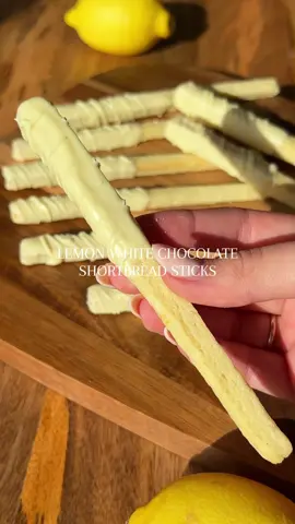 Lemon white chocolate shortbread sticks!  These are SO moreish and honestly quite easy to make. Full deets below. Enjoy !!!  Ingredients  300g / 2 1/2 cup plain flour  100g / 1/2 cup caster sugar 2 lemon zest  1 whole lemon juice  140g / 1 1/4 stick softened butter  1 tsp vanilla bean paste  150g / 3/4 cup white chocolate  1 tsp coconut oil  Instructions  1. Preheat your oven to 180C /360F.  2. Add the sugar and lemon zest to a bowl and massage together. Add the butter and vanilla, combine.  3. Add the flour and combine together until a buttery crumble forms. Add the lemon juice and knead together until a rough dough ball forms. Add a little bit more lemon juice if needed. 4. Place the dough between two pieces of baking paper and roll out until around 1 cm height. Cut into equal stick shapes, I did 1 cm width, 12cm length.  5. Carefully place onto a lined baking tray and bake for 10 minutes, until cooked but not too coloured. Cool. 6. Melt your chocolate, add the coconut oil and mix. Dip your biscuits in, leave to set and then drizzle more on top. Enjoy!!  #bakeoff #lemon #lemonwhitechocolatebiscuits #biscuits #shortbread #cookiesticks #sticks #lemondessert #baking #series 