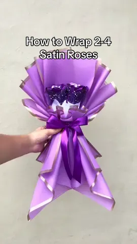 Replying to @🤍ZS🖤  Part 14. How to Wrap Two Satin Roses using 2 1/2 Wrapping Papers. #bouquet #bouquets #bouquettutorial #ribbonflowers #ribbonroses #tutorial #wrappingtutorial #bouquettutorial #craftersoftiktok #crafts #diy #fyp  #realmeซูมให้ได้ซีน 
