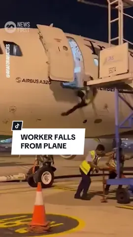 A crew member has taken a terrifying plunge into an airport runway, after falling from an open aeroplane door after crew removed the stairs. The flight crew of the TransNusa Airbus A320 in Indonesia had been preparing for take-off, with some colleagues moving a stepladder away from the boarded plane. The unnamed worker, amid conversation, hadn't noticed the stepladder had been removed until he was already plummeting. Early reports have indicated the injuries are not life-threatening, and the staffer is being treated in hospital. #10NewsFirst #Indonesia #JakartaAirport 
