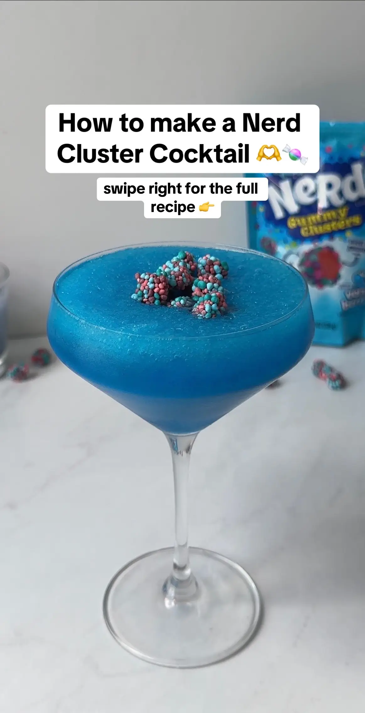 Add a pop of color to your day with this Frozen Nerds Cluster Cocktail!🍬💙 It's so refreshing, and perfect for a hot summer day!🤩 Comment below if you would try this!✨ #frozennerdsclustercocktail #frozen #nerdscluster #nerds #cocktail #candy #gummy #blueraspberry #frozencocktails #frozendrinks #boozy #nerdsgummyclusters