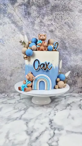 Oax is 2! Teddy bear themed cake for the lovely @marnie simpson  and @Casey Cody Johnson  Thank you for giving me creative freedom with this beauty! Made with: @FrostForm 7 inch kit @Colour Mill 🌈 White , Sky Blue, Lavender, Latte and Peach oil based colouring @FunCakes  white candy deco melts  @LissieLou  mini metal scrapers @pretty_flamingo_designs custom cake charms  @Cake Craft Company  gold balls, bunny tails and all cake supplies #indulgencebyjosephine #cakebaker #treatmaker #cakedecorator #dessertcreator #cakeartist #northlondondesserts #bespokecakedesign #designercake #designercakes  #colourmill #teddybeartheme #teddybearcake #bearcake #beartheme #marnie #geordieshore #cakesofinstagram #cakestagram #cakesdaily #caketrends #cakeideas #cakedecoratingideas #reelsofinstagram  #instagramreels #instareels #reelsinstagram #cakecraftcompany