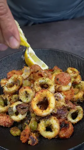 Savor the taste of the sea with this delicious Baked Calamari dish! 🦑🍅🧀 A perfect blend of fresh ingredients and rich flavors. Baked Calamari Ingredients: 3 squid 15 cherry tomatoes 50 grams of green olives (1/3 cup) 30 grams of Taggiasca olives (1/4 cup) 30 grams of grated Parmesan cheese (1/4 cup) 2 heaping tablespoons of breadcrumbs Oregano to taste Half a lemon (juice and zest) 5 basil leaves Salt and pepper to taste Olive oil to taste Instructions: Clean and Prepare the Squid: Clean the squid and cut them into rings. Prepare the Tomatoes: Make a small incision in the cherry tomatoes and blanch them in boiling water for 30 seconds. Cool them down, peel them, and cut them in half. Mix the Ingredients: In a bowl, mix the cherry tomatoes with green olives, Taggiasca olives, Parmesan cheese, breadcrumbs, oregano, the juice and zest of half a lemon, chopped basil leaves, salt, and pepper. Assemble the Dish: Place the squid rings in a baking dish, cover them with the tomato and olive mixture, and drizzle with olive oil. Bake: Bake in a preheated oven at 190°C (375°F) for about 20 minutes or until the squid is crispy. #SeafoodLovers #BakedCalamari #HomeCooking #ItalianCuisine #DeliciousDishes #Foodie @GialloZafferano 