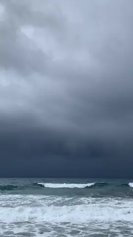 gloomy weather at the beach hits different. 🌊🌧️  #fyp 