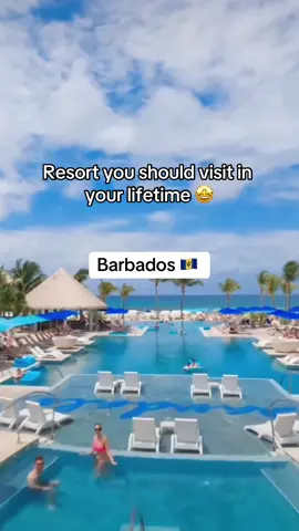 Is this on your bucklist? 🤩 Sandals Royal Barbados is a luxurious all-inclusive resort located on the stunning Maxwell Beach in the vibrant St. Lawrence Gap area. It features opulent suites with Tranquility Soaking Tubs™, an infinity pool, a rooftop pool and bar, and nine gourmet restaurants offering diverse cuisines. Guests enjoy unlimited premium liquors, water sports, and nightly entertainment, with access to additional amenities at the adjacent Sandals Barbados. Perfect for couples, it provides a romantic and indulgent getaway with top-tier service and facilities.  #barbados #barbadostiktok #barbados🇧🇧 #allinclusiveresort #allinclusive #resort #traveltok #resorts 