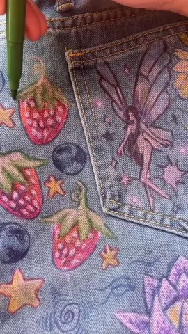 ✧.*ᴡʜɪᴍꜱʏ ᴘᴀɴᴛꜱ⋆·˚ ༘ *🪼🍓🫐🌷🪿 finally finished these pants i have been working so long on !  #art #aesthetic #fabricmarkers #berries #flowers #fantasticmrfox #jellyfish #fish #clothingart #whimsical 