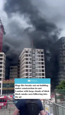 🚨BREAKING NEWS 🚨 A huge fire has broken out on a building in East London as large clouds of black smoke can be seen in the air. Ten fire engines and around 70 firefighters are responding to a fire near Silvertown Way in Canning Town, the London Fire Brigade has confirmed. A statement by the brigade said: 'The fire is located in a construction site. One of the Brigade's 64m ladder has been deployed to the scene. People are advised avoid the area as crews respond. 🎥 Twitter/TrisCoach #breaking #london #fire #canningtown #londonnews #news 